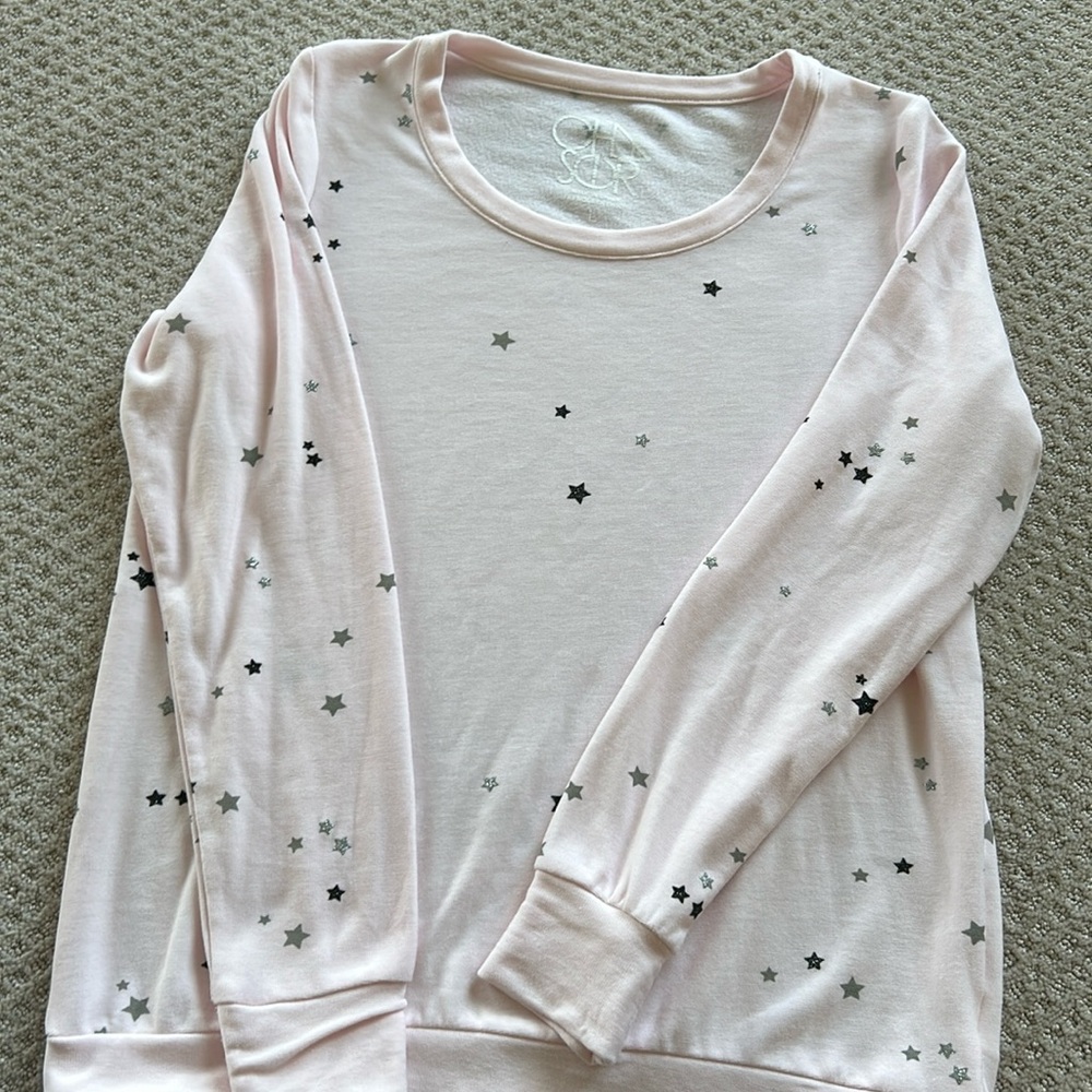 Chaser long sleeve top. Light pink with stars. Size Large.
